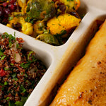 Close-up of beef lasagne with bechamel and the two winter salads - Route Catering