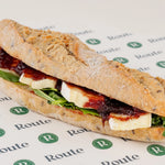 Close-up of the Brie and Cranberry Baguette filling with brie, cranberry sauce and rocket - Route Catering