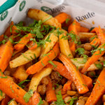 Close-up of roasted carrot and parsnip salad with chickpeas and pomegranate molasses - Route Catering