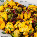 Close-up of turmeric cauliflower and Brussels sprouts with pomegranate and cranberry - Route Catering