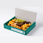 Cheese selection with orange, grapes and cheese straws, office catering London