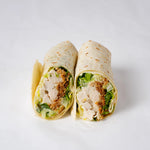 Close up of chicken Caesar wrap with lettuce and parmesan, Route Catering London