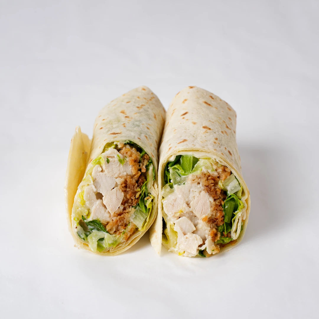 Close up of chicken Caesar wrap with lettuce and parmesan, Route Catering London