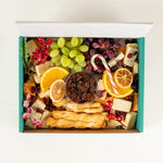 Christmas Cheese Platter with cheeses, grapes, chutney, breadsticks and dried orange from above, serves 10 - Route Catering