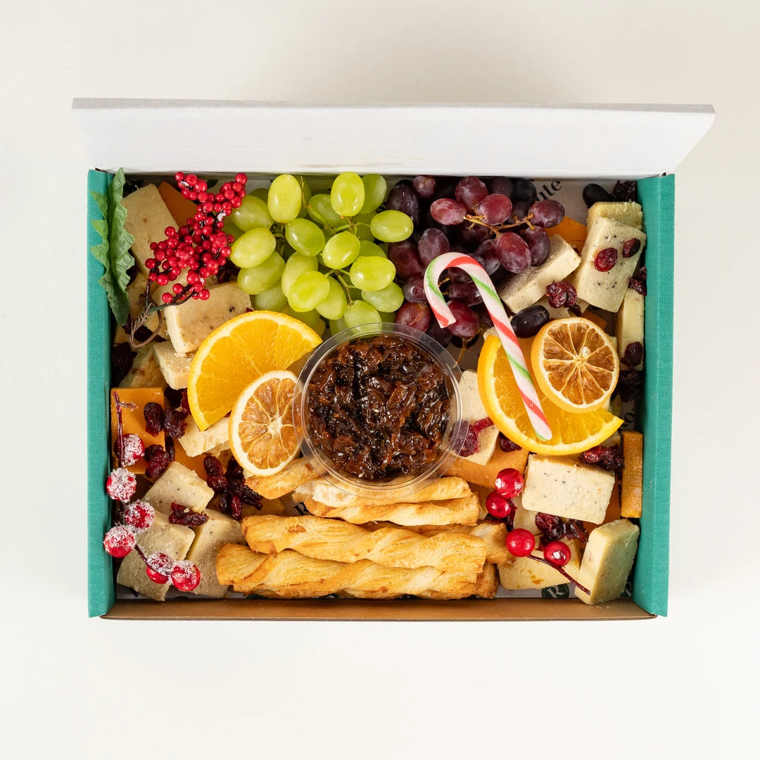 Christmas Cheese Platter with cheeses, grapes, chutney, breadsticks and dried orange from above, serves 10 - Route Catering