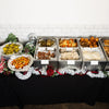 Christmas dinner pop-up buffet line with roast turkey, trimmings and festive decorations by Route Catering