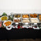 Christmas dinner pop-up buffet line with roast turkey, trimmings and festive decorations by Route Catering