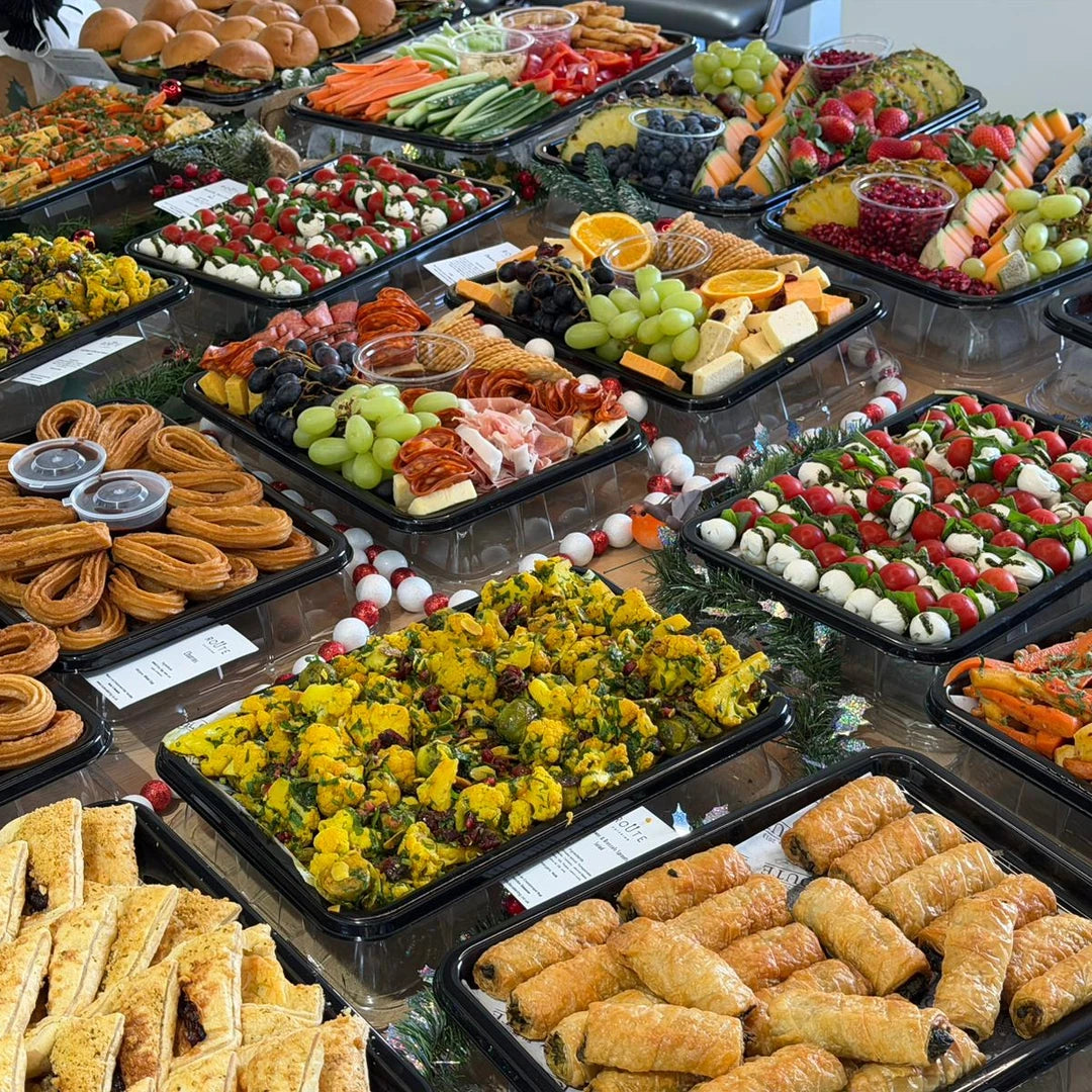 Christmas graze platters close up with charcuterie, cheese, dips and festive salads