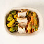 Xmas Turkey Lunchbox from above, sliced roast turkey on Brussels sprout and cauliflower salad and carrot and parsnip salad - Route Catering