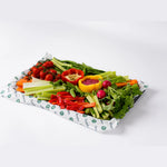 Fresh vegetable crudites with dips on branded paper, Route Catering London