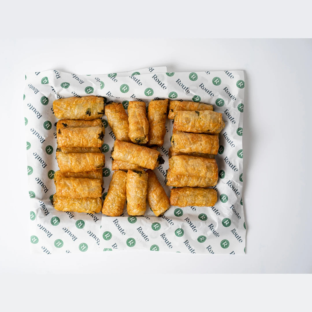 Close up of spinach and cheese filo pastry rolls, Route Catering London