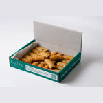 Filo pastry rolls arranged on branded paper, office catering London, Route Catering