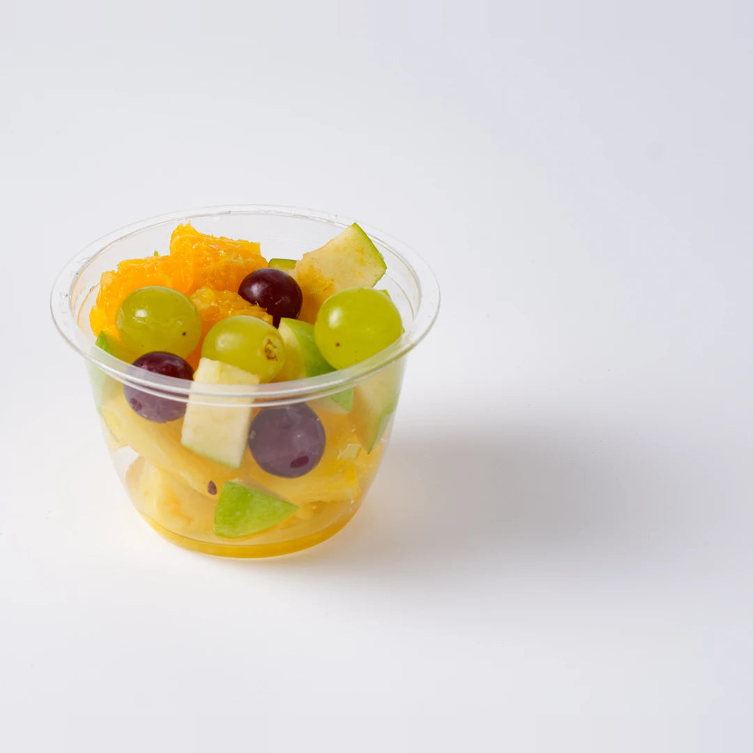 Fresh fruit pot with grapes, melon and orange, office catering London, Route Catering