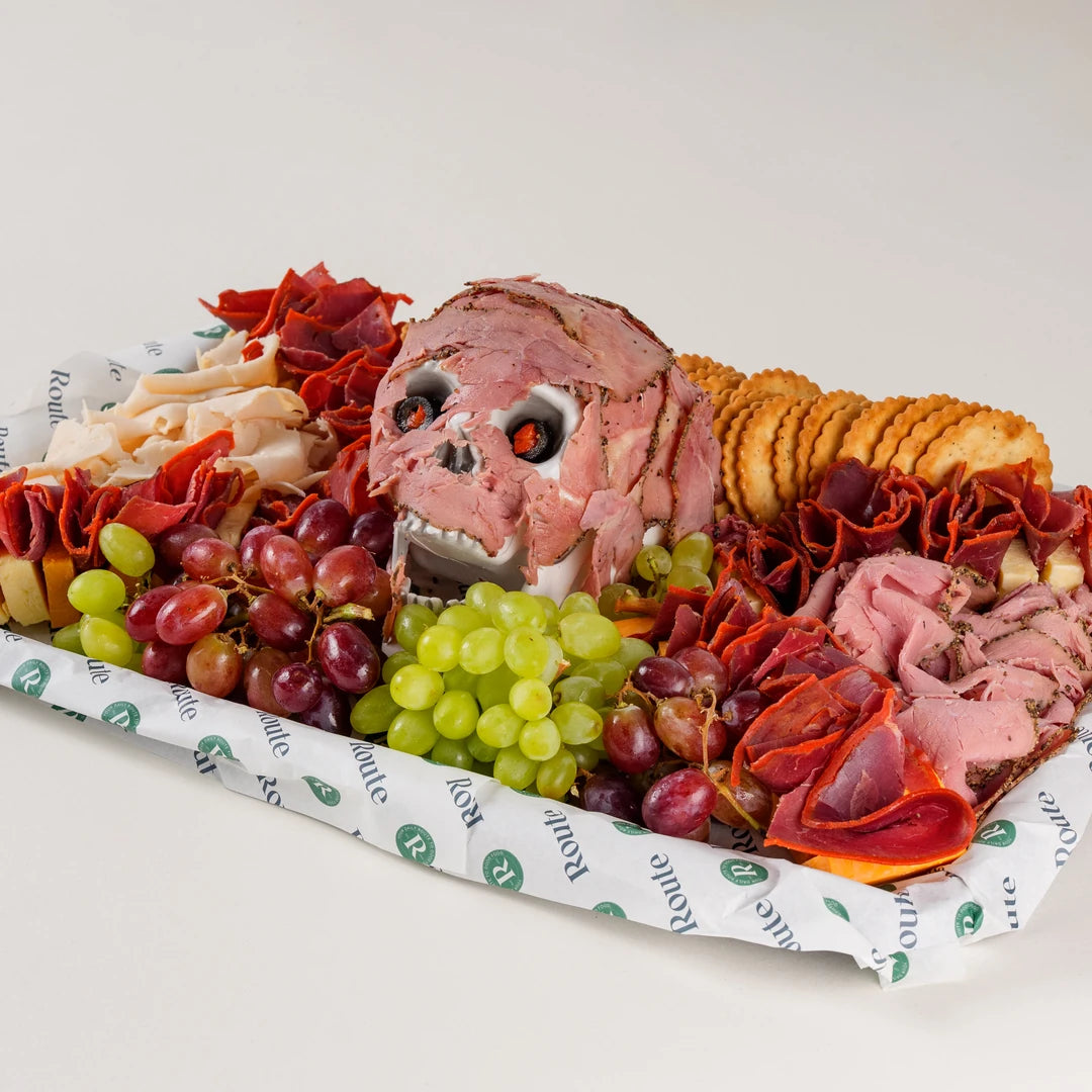 Halal Flesh Board Halloween charcuterie platter, side view of the beef pastrami skull - Route Catering