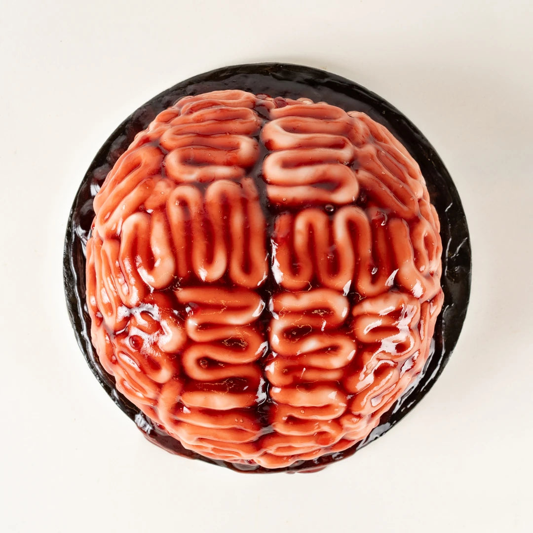 Halloween Brain Cake from above, pink brain-shaped cake with red jam blood, serves 25 - Route Catering
