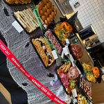 Halloween graze platters with sandwiches, charcuterie and Beware Keep Out ribbon