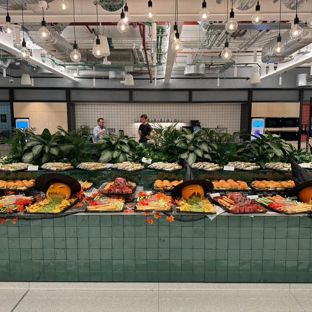 Long Halloween graze table set up in a London office canteen