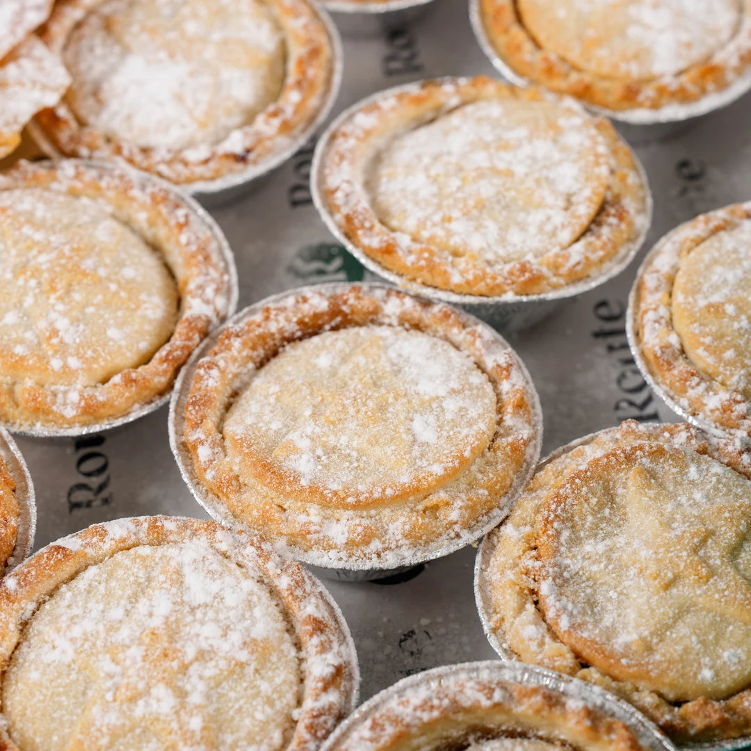 Close-up of classic mince pies dusted with icing sugar - Route Catering