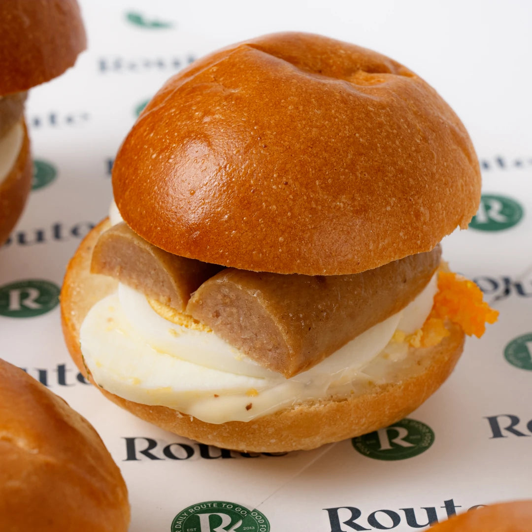 Mini breakfast roll with sausage and boiled egg, Route Catering London