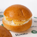 Close up of mini breakfast roll with egg and cheese, Route Catering London