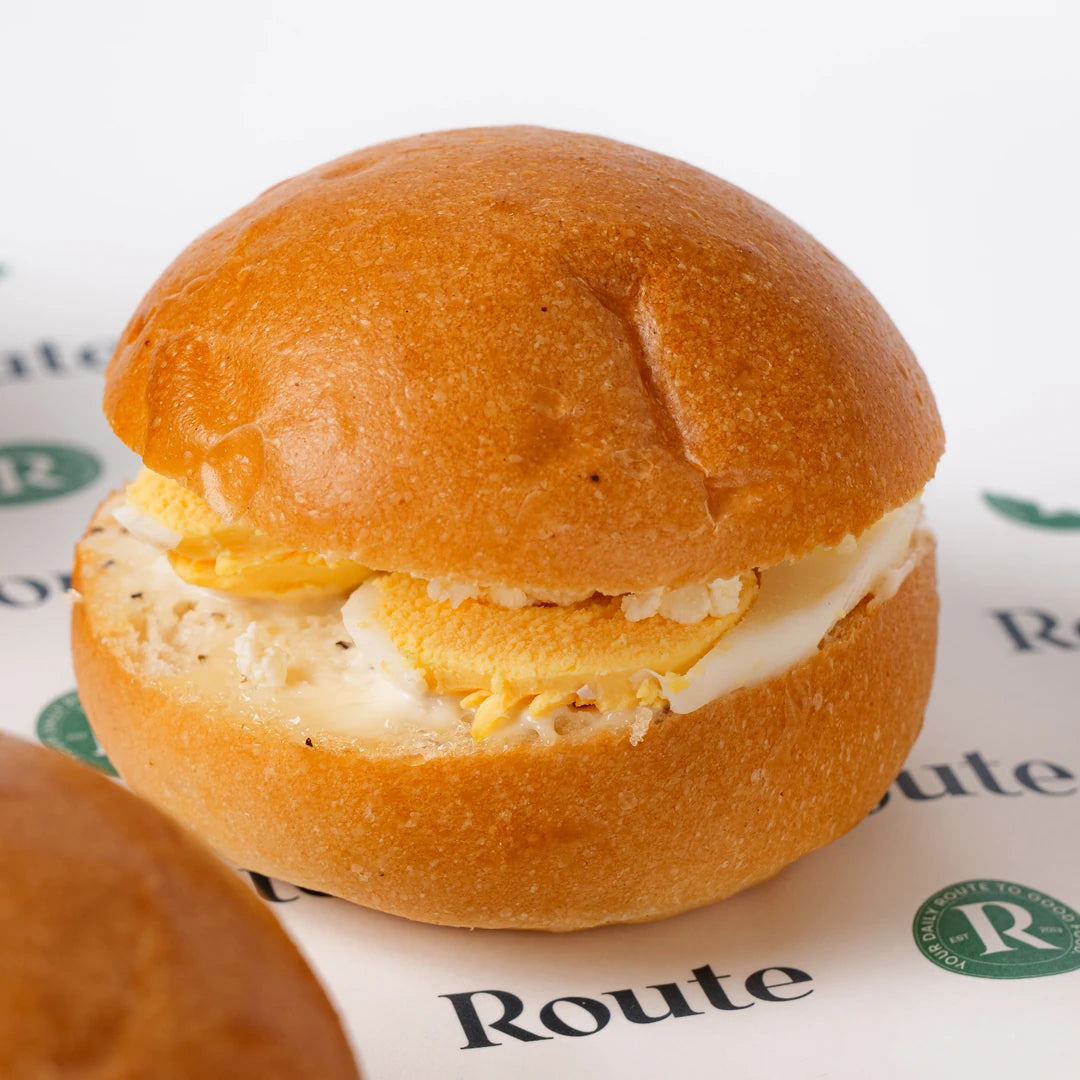 Close up of mini breakfast roll with egg and cheese, Route Catering London
