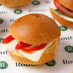 Close up of mini breakfast roll with red pepper and cheese, Route Catering London