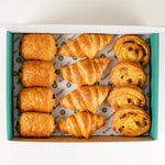 Mixed Pastry Platter of 12 croissants, pains au chocolat and pains aux raisins in a Route Catering box from above