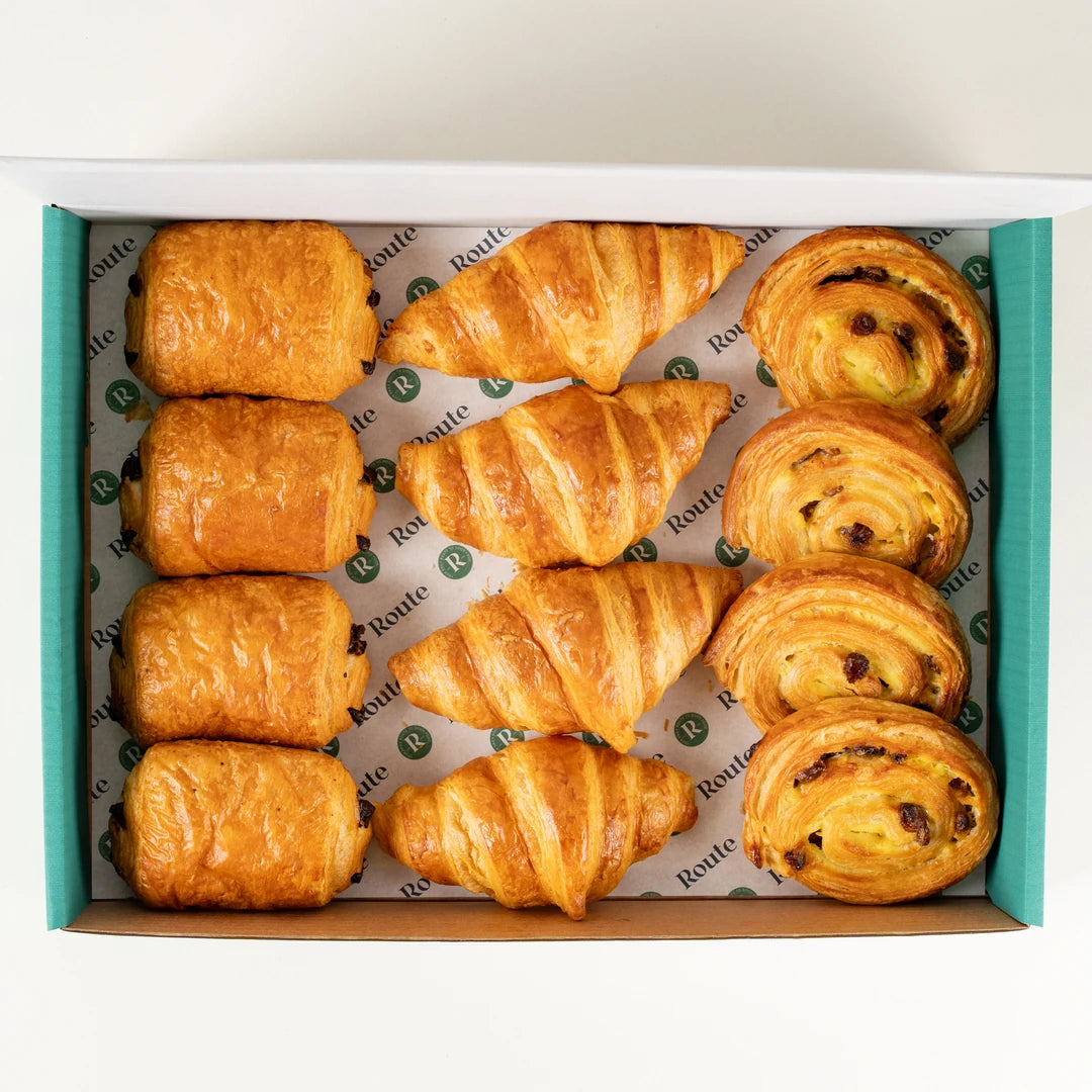 Mixed Pastry Platter of 12 croissants, pains au chocolat and pains aux raisins in a Route Catering box from above