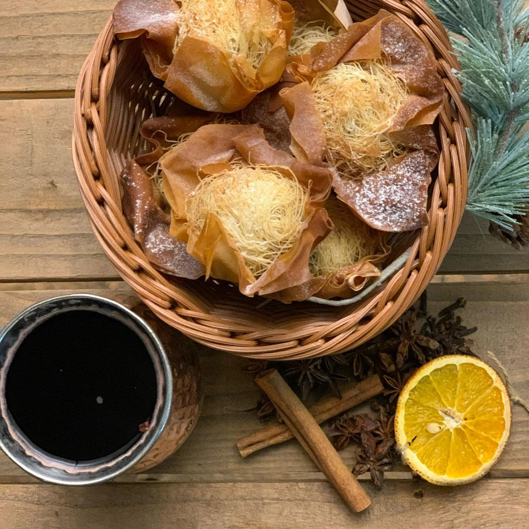 Basket of filo mince pies with a cup of mulled wine, orange and cinnamon by Route Catering