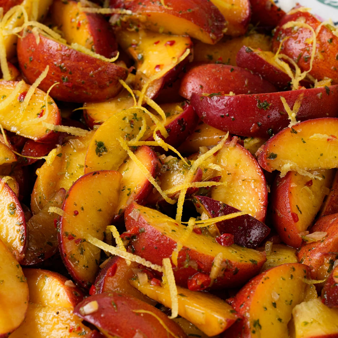 Close up of peach salad with basil and red chilli, Route Catering London