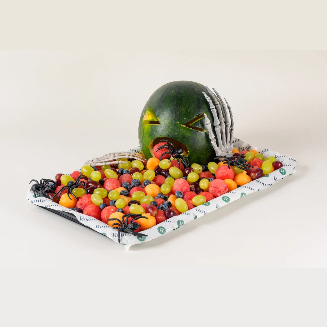Puking Watermelon Halloween fruit platter with carved watermelon, grapes, melon and berries, serves 10 - Route Catering