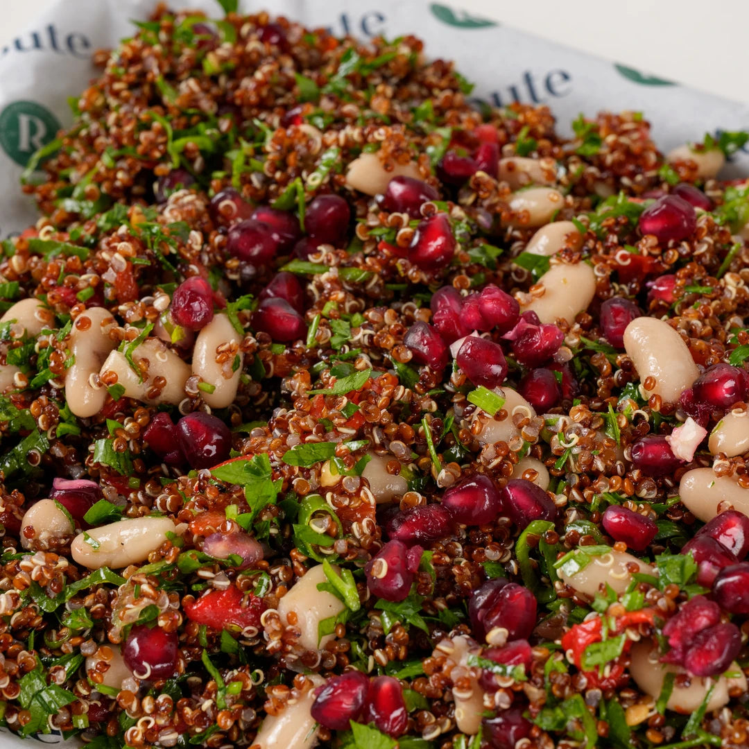Close-up of red quinoa salad with cannellini beans, pomegranate and parsley - Route Catering