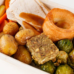 Close-up of roast chicken, Yorkshire pudding, stuffing and roast potatoes in the Roast Chicken Dinner box - Route Catering