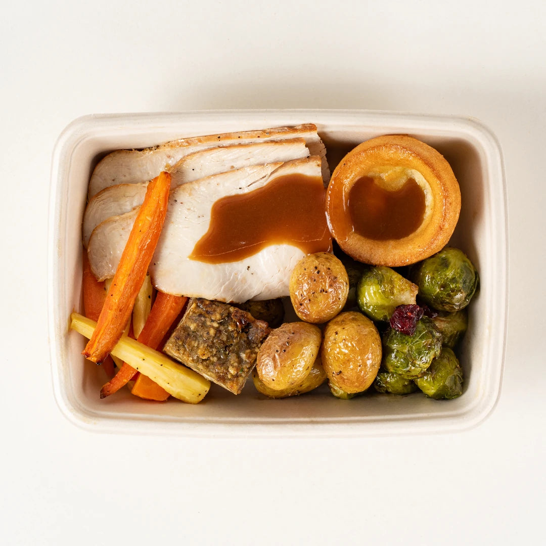 Roast Chicken Dinner box from above with chicken, Yorkshire pudding, stuffing, roast potatoes, sprouts, carrots and parsnips - Route Catering