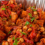 Close-up of roasted sweet potato with tomato and chickpea salsa - Route Catering
