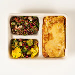 Roasted Vegetable Lasagne Lunchbox from above with cauliflower and Brussels sprout salad and red quinoa salad - Route Catering
