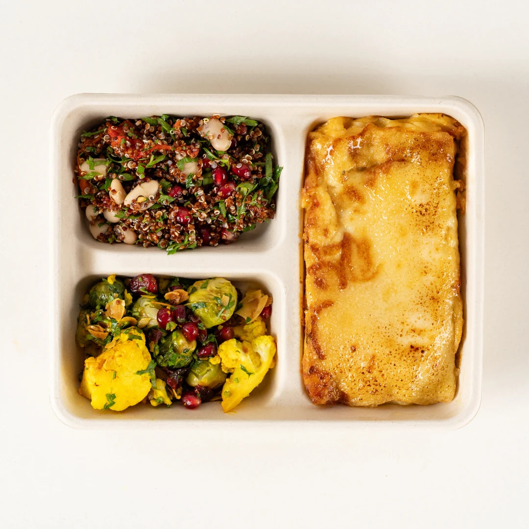 Roasted Vegetable Lasagne Lunchbox from above with cauliflower and Brussels sprout salad and red quinoa salad - Route Catering