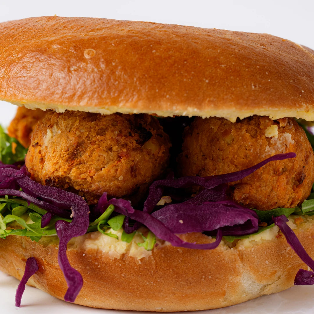 Vegan kofta bagel with hummus and salad, plant based catering London