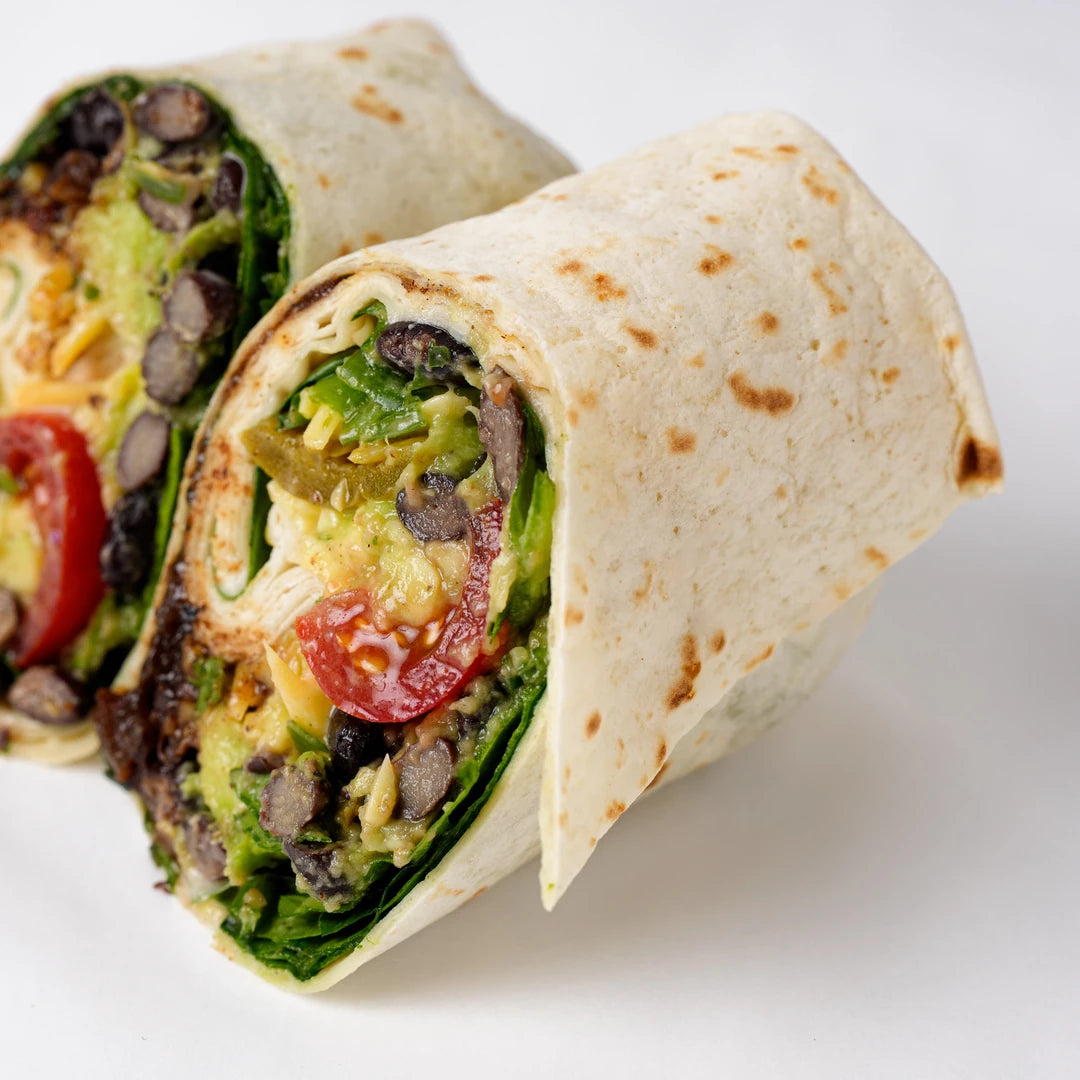 Close up of vegan wrap with avocado, spinach and tomato, Route Catering London