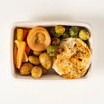 Vegetarian Roast Dinner box from above with Farmers Winter Wellington, Yorkshire pudding, stuffing, roast potatoes, sprouts, carrots and parsnips - Route Catering