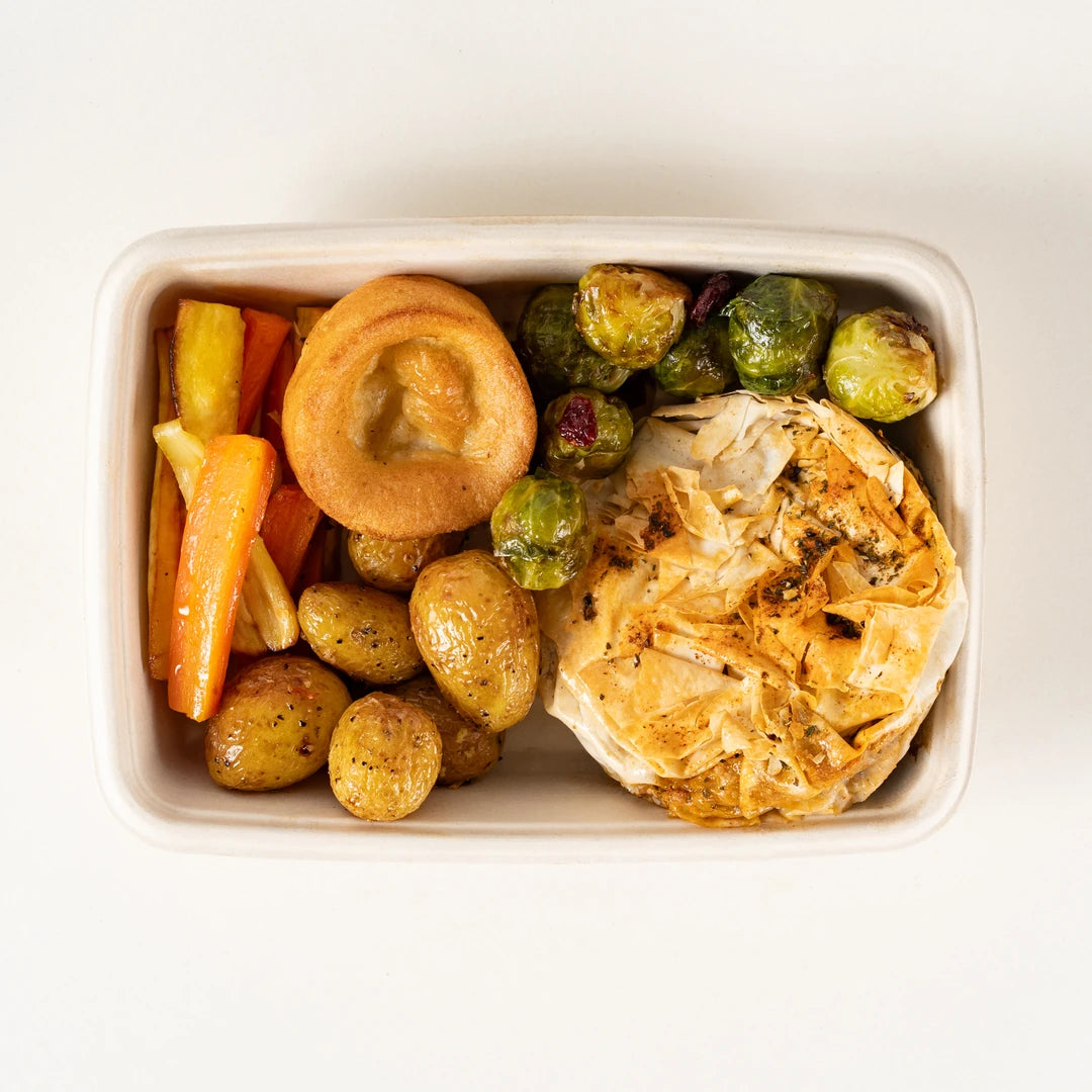 Vegetarian Roast Dinner box from above with Farmers Winter Wellington, Yorkshire pudding, stuffing, roast potatoes, sprouts, carrots and parsnips - Route Catering