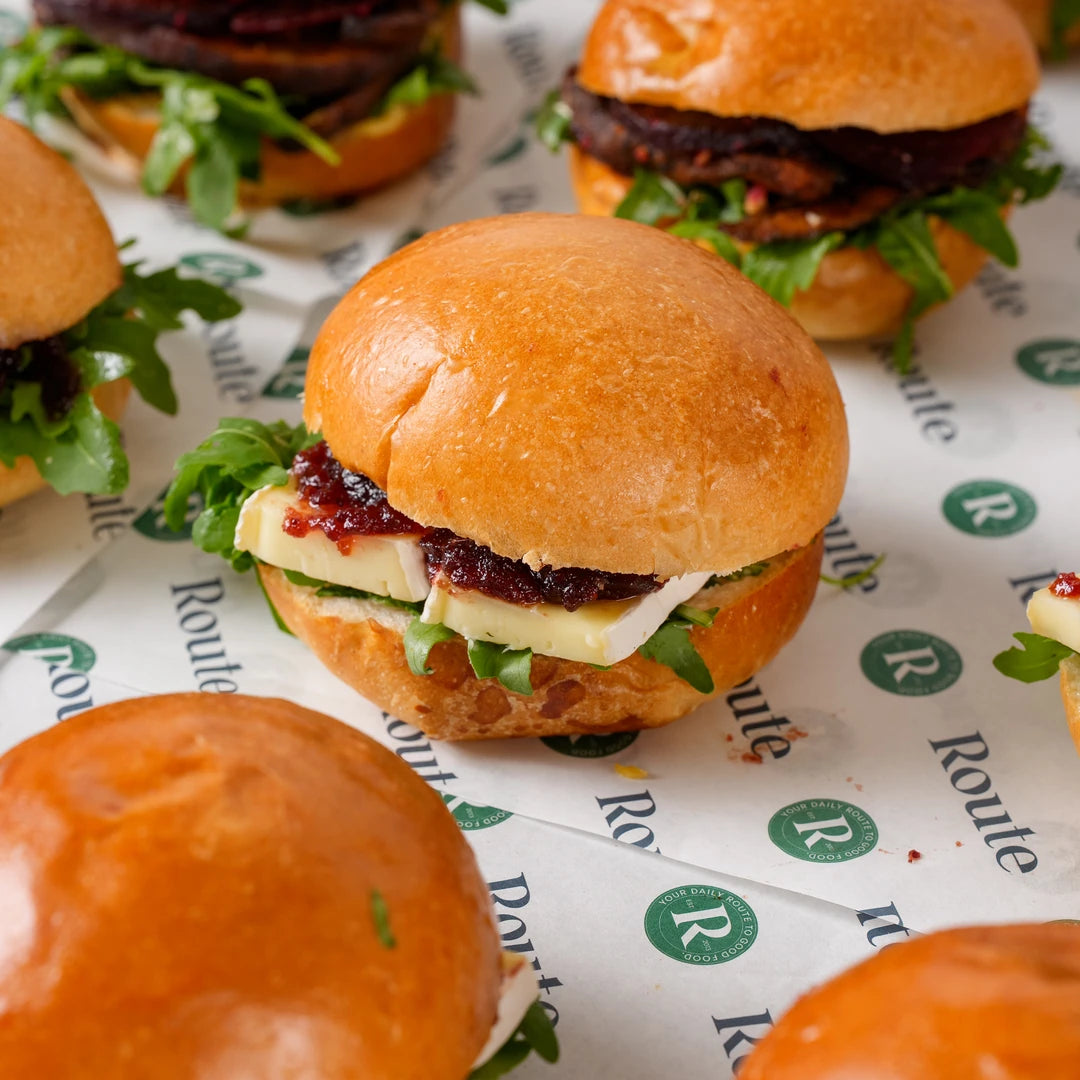 Close-up of a vegetarian mini Christmas roll with brie, cranberry and rocket - Route Catering