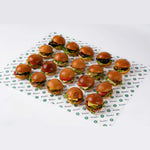 Vegetarian mini sandwiches arranged on branded paper, Route Catering London