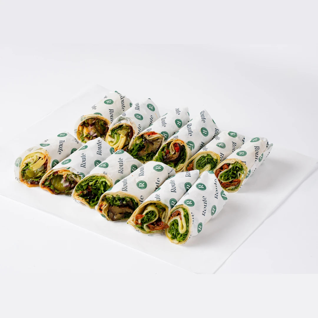 Vegetarian sandwich wraps arranged on branded paper, serves 6, Route Catering London